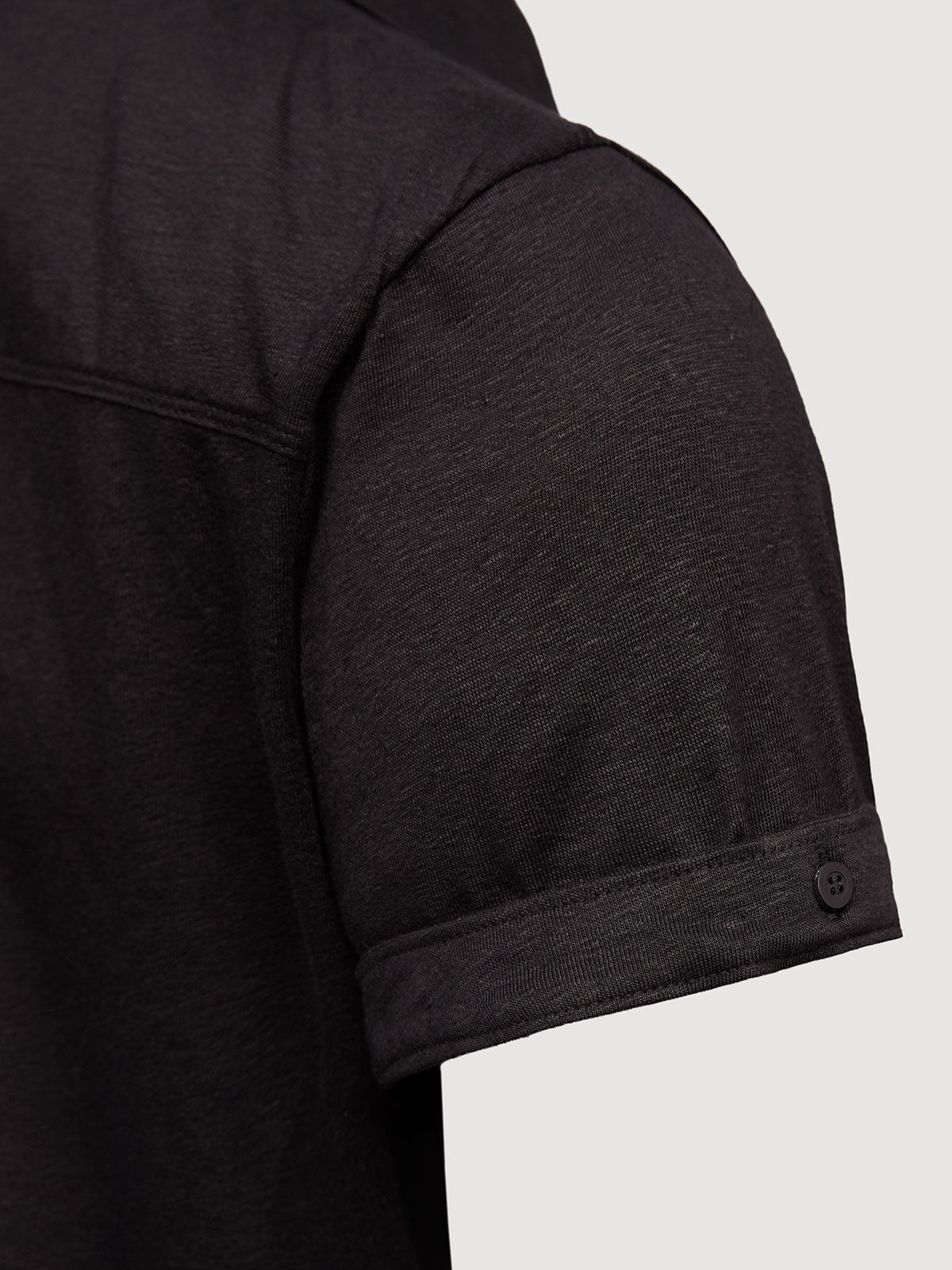 Madeira French Linen Short Sleeve Polo in *Berlin Black* (black) — sleeve cuffed detail | Y.Chroma