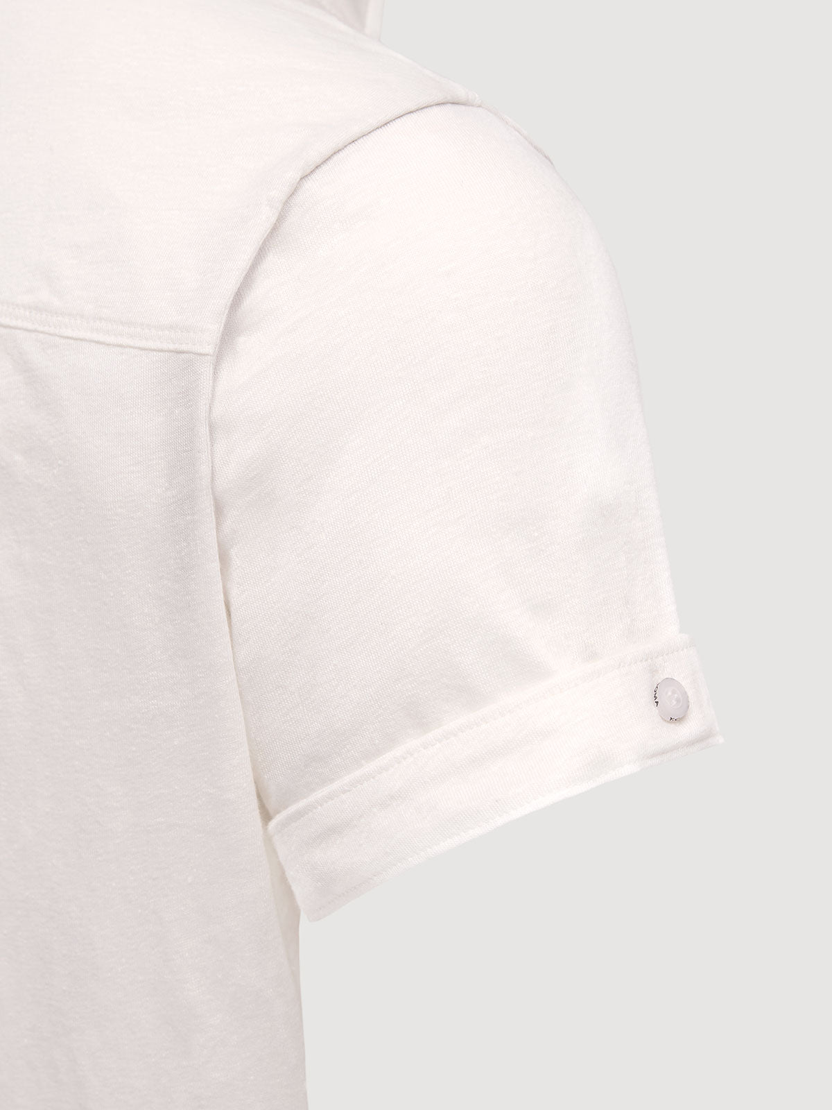 Madeira French Linen Short Sleeve Polo in *White Lotus* (off-white) — sleeve cuffed detail | Y.Chroma