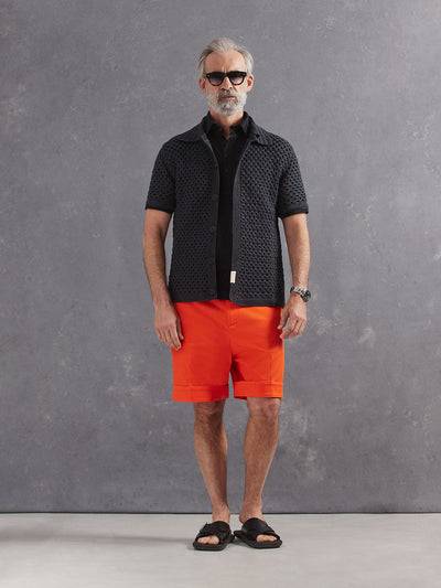 Madeira French Linen Short Sleeve Polo in *Berlin Black* (black) styled with Aperol Orange Becker Short and Obsidian Gray Grand Prix Hand Crocheted Shirt — full length lookbook | Y.Chroma