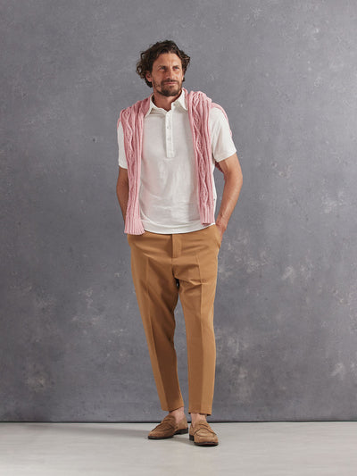Madeira French Linen Short Sleeve Polo in *White Lotus* (off-white) styled with Dark Soybean Retinol Pant and Quartz Pink Power Cable Sweater 2023 Edition on shoulders — full length lookbook | Y.Chroma