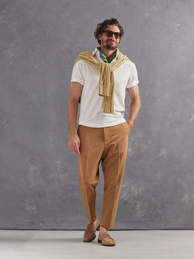 Madeira French Linen Short Sleeve Polo in *White Lotus* (off-white) styled with Dark Soybean Retinol Pant and Soybean Power Cable Sweater 2023 Edition on shoulders — full length lookbook | Y.Chroma